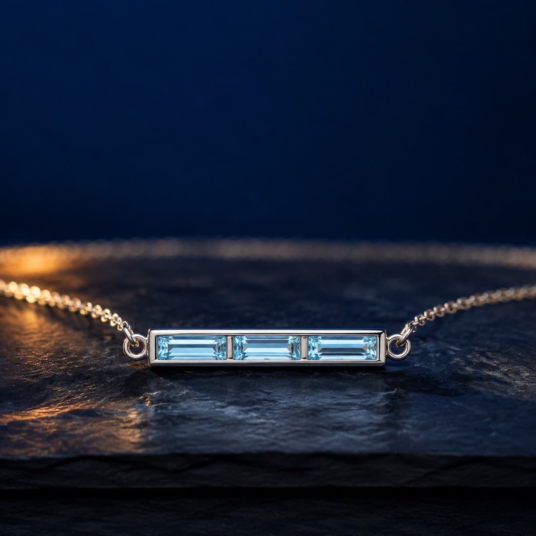Aquamarine Bar Necklace — Three baguette aquamarines set in a line along a silver bar.