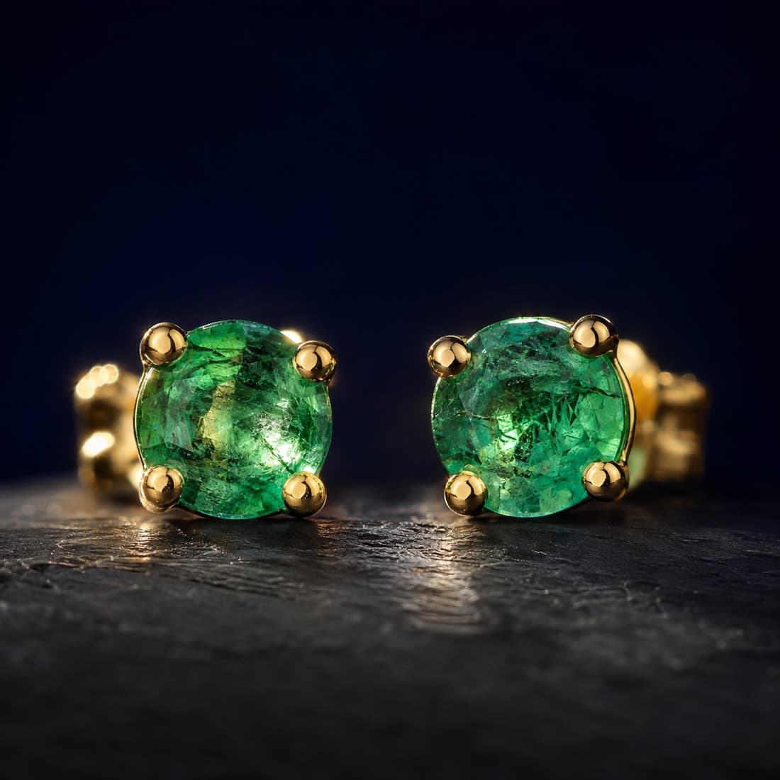 Emerald Stud Pair 4 mm — 9ct Gold — Matched natural emeralds, fracture-filled, in hallmarked 9ct gold.